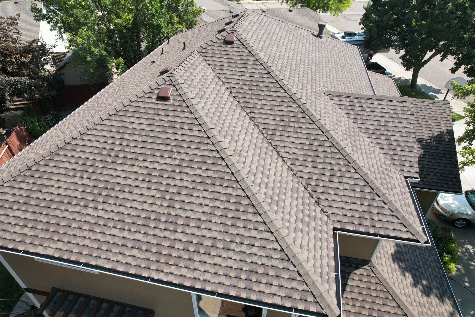 Aerial view of a brown laminated asphalt shingle roof on a Boise home, installed by Bork Roofing.